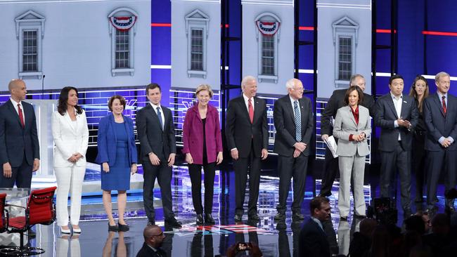 Democratic presidential candidates Sen. Cory Booker (D-NJ), Rep. Tulsi Gabbard (D-HI), Sen. Amy Klobuchar (D-MN), South Bend, Indiana Mayor Pete Buttigieg, Sen. Elizabeth Warren (D-MA), Former Vice President Joe Biden, Sen. Bernie Sanders (I-VT), Sen. Kamala Harris (D-CA), Andrew Yang, and Tom Steyer wait the start of the fifth Democratic Presidential Debate. Picture: Getty Images