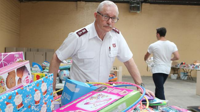 Major Neil Dickson from the Salvation Army at a Christmas hamper packing station. Picture: Jono Searle.