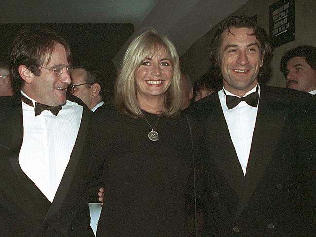 Penny Marshall poses with co-stars of "Awakenings" Robin Williams, left, and Robert De Niro at the premiere of the film in New York. Picture: AP