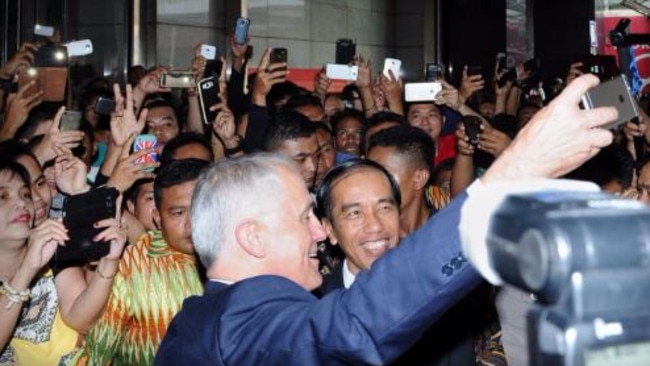 Turnbull and Indonesian president Joko Widodo take a selfie as they visit the Tanah Abang retail market in Jakarta. Picture: Supplied