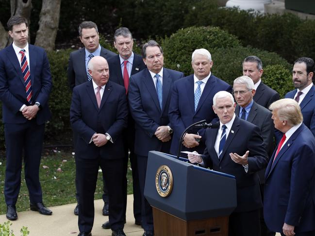 Vice- President Mike Pence gestures to President Donald Trump during a news conference about the coronavirus on Friday. Picture: AP