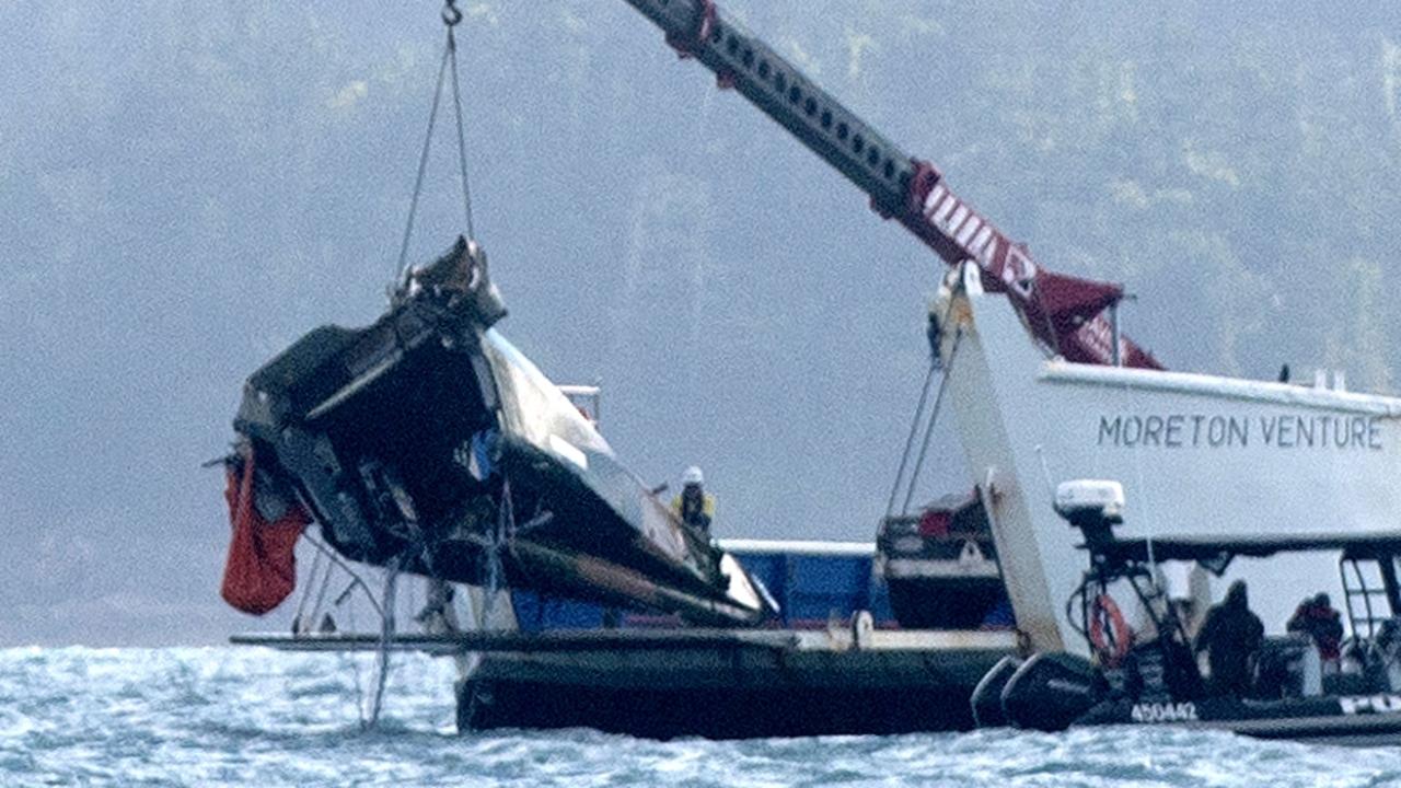 The wreckage of MRH 90 Taipan military helicopter crashed being lifted out of Whitsundays waters. Picture: Michaela Harlow