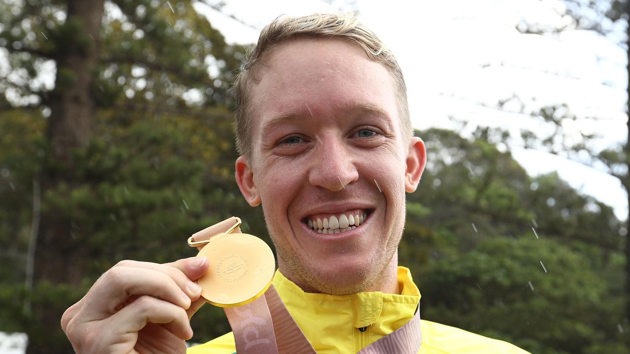 Cameron Meyer poses after winning the gold medal in the cycling time trial.