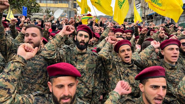 Hezbollah militants attend the funeral of one of the militant group's commanders killed by an Israeli air raid. Picture: AFP.