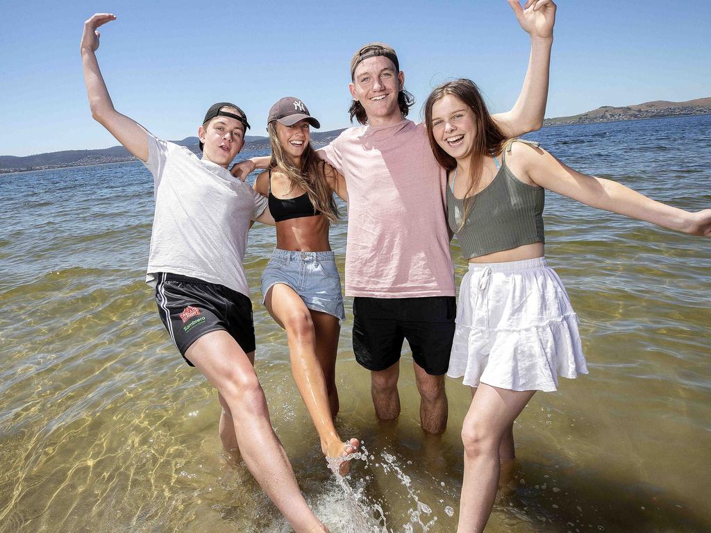 Jack Johnson, 16, Summer Wignall, 15, Kitean Aitken, 16, and Millie Lamprecht, 16, at Long Beach, Sandy Bay, enjoying the heat on the last day of spring. Picture: Chris Kidd