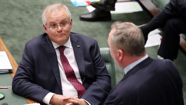 Scott Morrison and Barnaby Joyce confer during question time in Parliament House, Canberra, on Monday. Picture: Gary Ramage