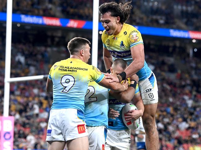 BRISBANE, AUSTRALIA - MAY 07: Kieran Foran of the Titans celebrates with team mates after scoring a try during the round 10 NRL match between Gold Coast Titans and Parramatta Eels at Suncorp Stadium on May 07, 2023 in Brisbane, Australia. (Photo by Bradley Kanaris/Getty Images)