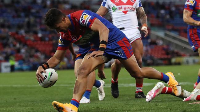 Newcastle's Enari Tuala scores a try for Newcastle. Picture: Brett Costello