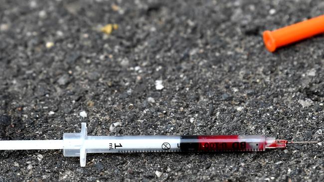 A blood filled needle in a laneway outside the safe injecting room in Richmond. Picture: Nicole Garmston