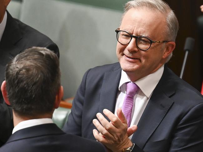 CANBERRA, Australia, NewsWire Photos. May 14, 2024: Prime Minister Anthony Albanese congratulates Federal Treasurer Jim Chalmers after he handed down the 2024-25 Federal Budget at Parliament House in Canberra. Picture: NCA NewsWire / Martin Ollman