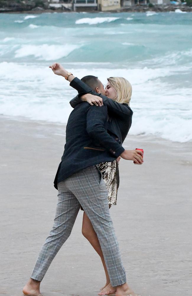 A couple celebrate under grey skies at Bondi today. Picture: MatrixNews