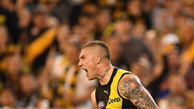 The Tiger army helps Dustin Martin celebrate a goal against GWS. Picture: Julian Smith/AAP