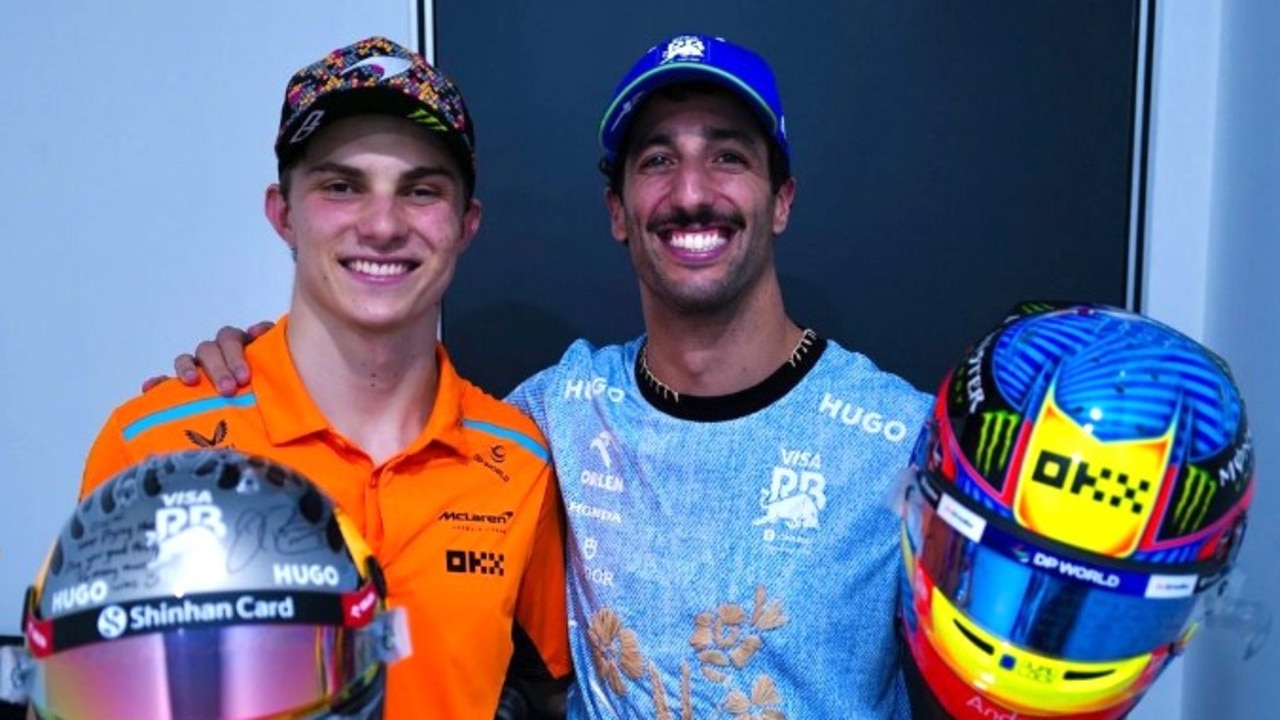 Daniel Ricciardo and Oscar Piastri swap helmets. Photo: Instagram, @danielricciardo.