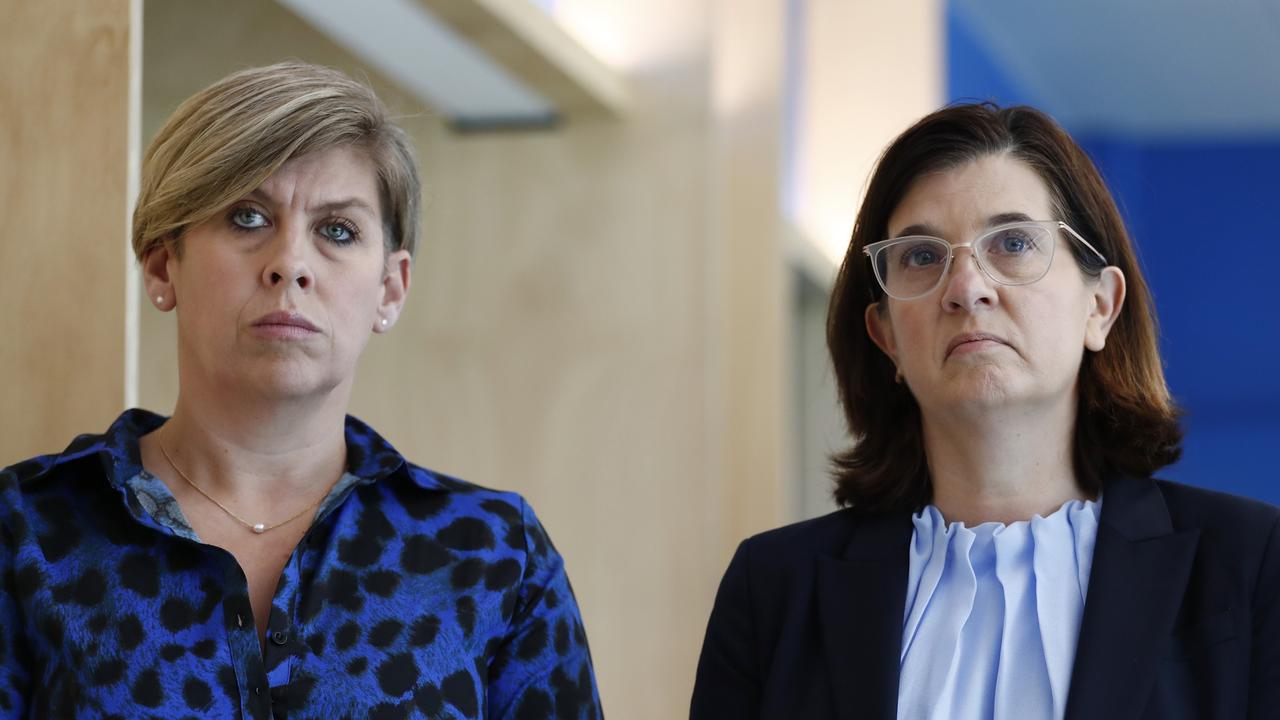 North Melbourne CEO Jen Watt and president Sonja Hood look on as Todd Viney speaks to the media. Picture: Darrian Traynor/Getty Images