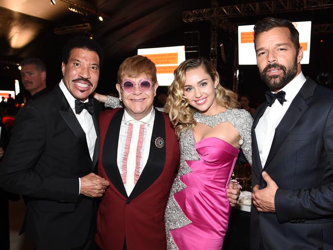 Lionel Richie, Elton John, Miley Cyrus and Ricky Martin at John’s annual Oscar bash. Picture: Dimitrios Kambouris/Getty Images for EJAF