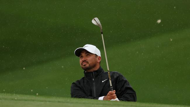 Jason Day plays a shot from a bunker on the seventh hole. Picture: AFP