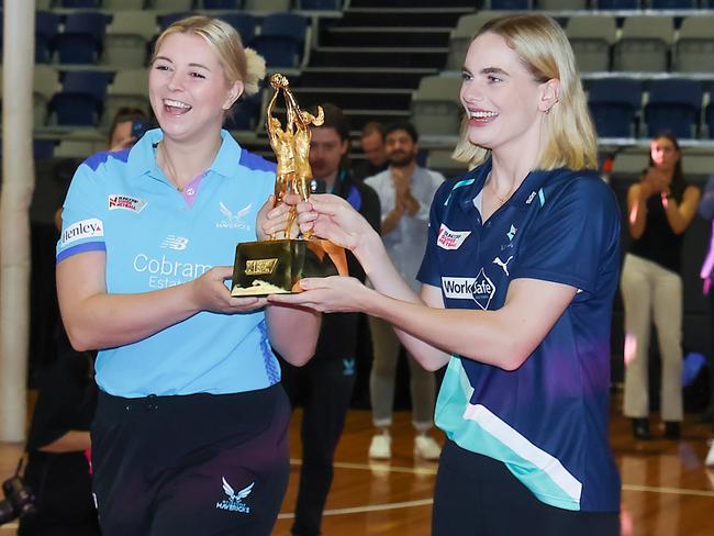 Mavericks shooter Eleanor Cardwell and Vixens goal attack Kiera Austin with the SSN trophy at the Melbourne launch of Fox Netball for 2024. Picture: Ian Currie