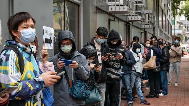 Residents wait in line at a makeshift COVID-19 testing station as the government rolls out mandatory testing for its entire population. Picture: Getty Images.