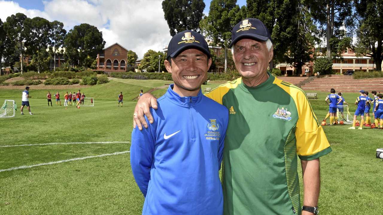 Hiroshi Imai and Rale Rasic talk football during the Toowoomba Grammar School clinic. Picture: Bev Lacey