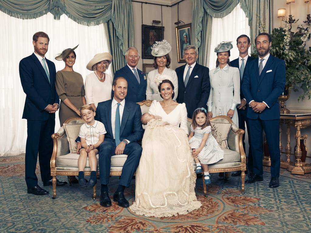 The Duke and Duchess of Cambridge, (Seated left to right) Prince George, The Duke of Cambridge, Prince Louis, The Duchess of Cambridge, Princess Charlotte, (Standing left to right) The Duke of Sussex, The Duchess of Sussex, The Duchess of Cornwall, The Prince of Wales, Mrs. Carole Middleton, Mr. Michael Middleton, Mrs. Pippa Matthews, Mr. James Matthews, Mr. James Middleton pose for an Official Portrait following the christening of Prince Louis taken in the Morning Room at Clarence House in St James's Palace on July 9, 2018 in London, England. (Photo by CAMERA PRESS/Matt Holyoak/The Duke and Duchess of Cambridge via Getty Images)