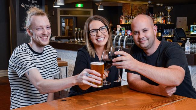 Wakefield Hotel owner Elle Apps shares an off-duty drink with duty manager Steve Moule and head chef Benjamin Lang. Picture: Brenton Edwards