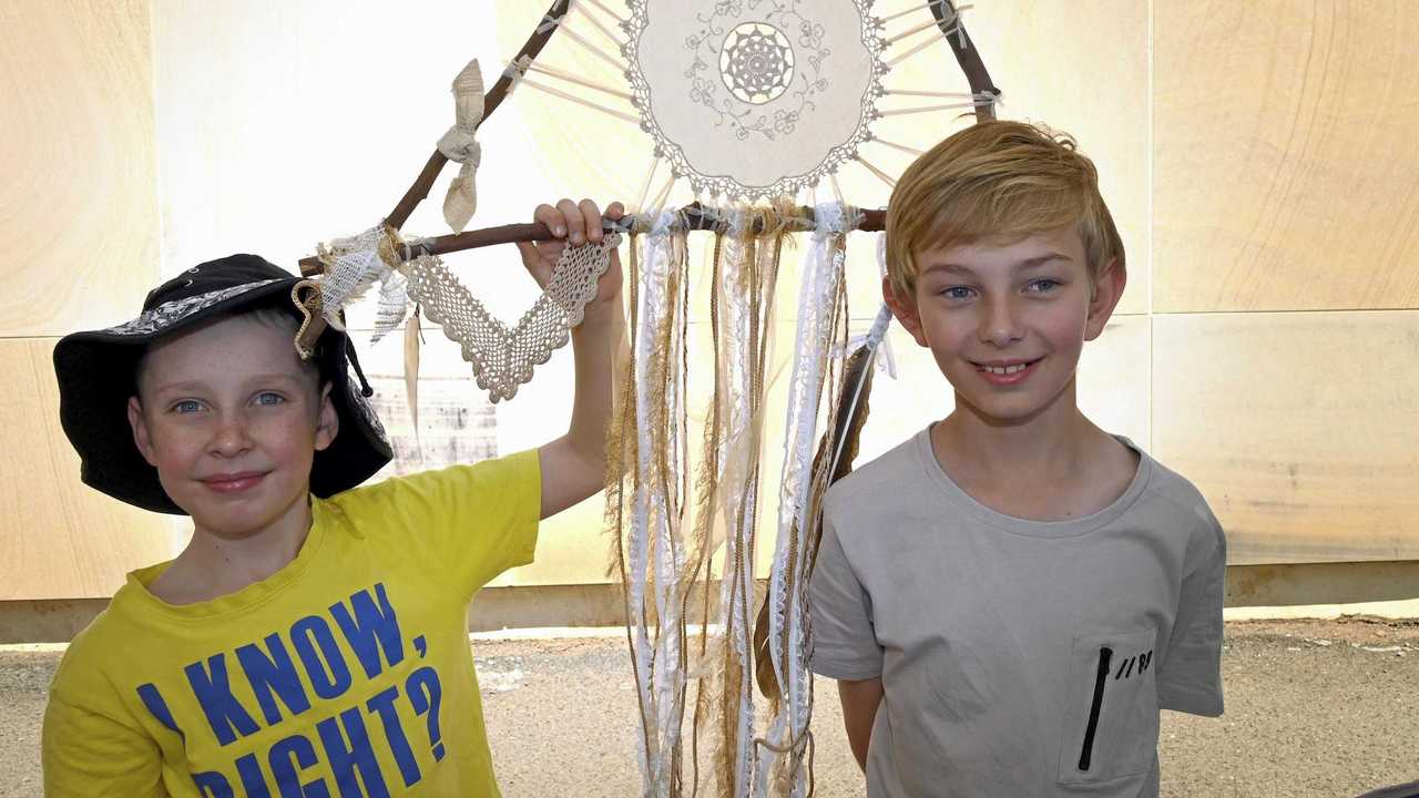 Lachlan Mauger (left) and his brother Jack Mauger check out the stalls and displays at the festival. Picture: Bev Lacey