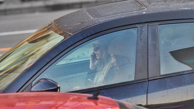 Drivers on Mobile phones on Flinders St in Melbourne. Picture: Tony Gough