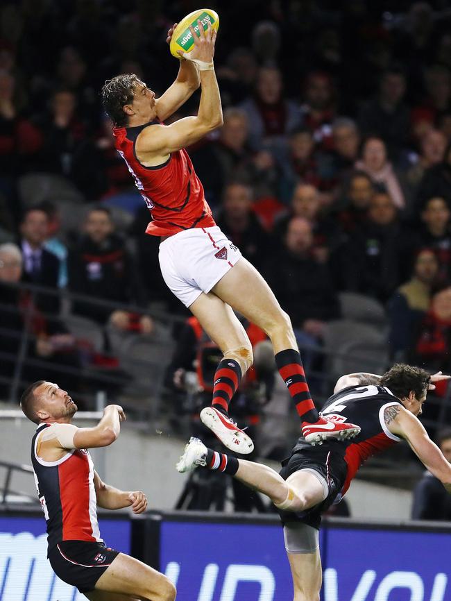 Joe Daniher takes a speccie over Jake Carlisle. Picture: Michael Klein