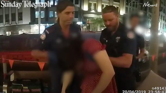 Paramedics treat the woman outside the venue.