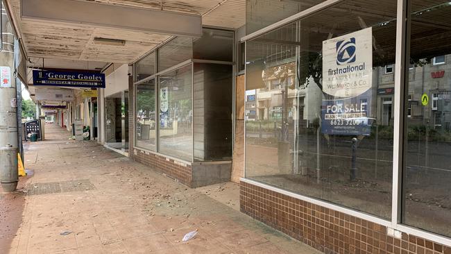 Lismore CBD remains a ghost town with boarded up businesses, gutted shops, all with a film of flood water dust - an eerie reminder of the town’s devastation. Picture: Cath Piltz