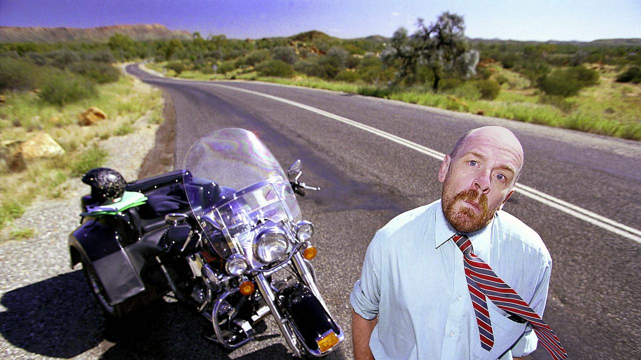 Alice Springs based lawyer Chris Turner was given permission to carry Olympic torch while riding his Harley-Davidson motorcycle during the Australia-wide relay for the Sydney Olympics. Picture: File