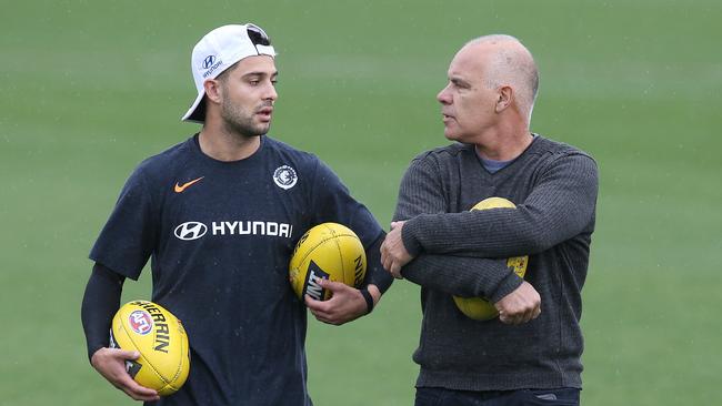 Michael Gibbons, left, with Greg Williams at Carlton training.