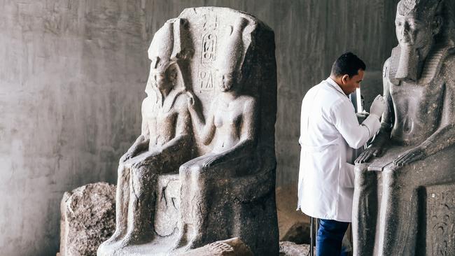 Statue restoration at the Grand Egyptian Museum.