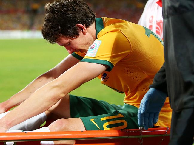 SYDNEY, AUSTRALIA - JANUARY 31: Robbie Kruse of Australia is taken from the field on a stretcher during the 2015 Asian Cup final match between Korea Republic and the Australian Socceroos at ANZ Stadium on January 31, 2015 in Sydney, Australia. (Photo by Mark Nolan/Getty Images)