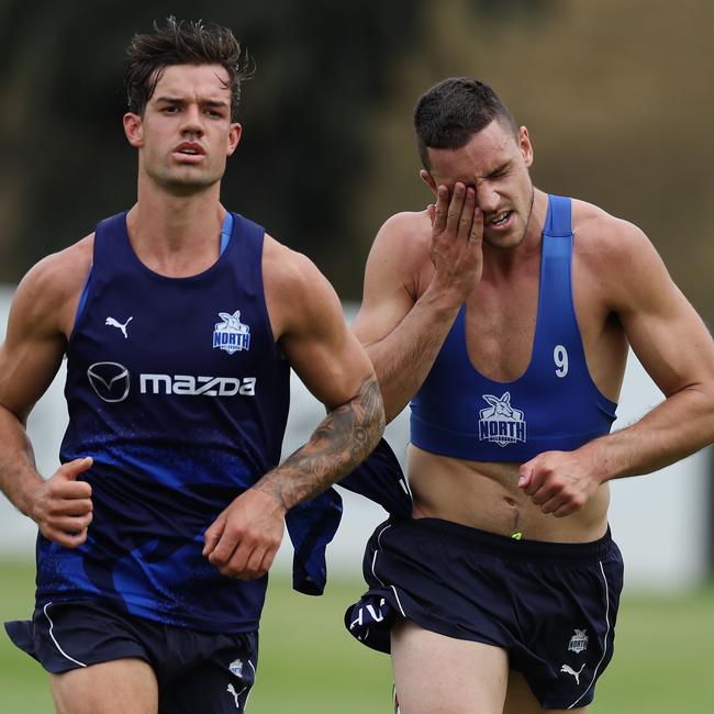 Important Kangaroos midfielders Jy Simpkin (left) and Luke Davies-Uniacke are both under fitness clouds ahead of the clash with Melbourne on Saturday night. Picture: Michael Klein