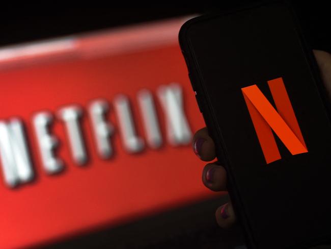 (FILES) In this file photo taken on March 31, 2020 a computer screen and mobile phone display the Netflix logo in Arlington, Virginia. - Netflix on January 20, 2022 reported it ended the year with 221.8 million subscribers, slightly missing its forecast while reporting earnings in line with expectations. (Photo by Olivier DOULIERY / AFP)