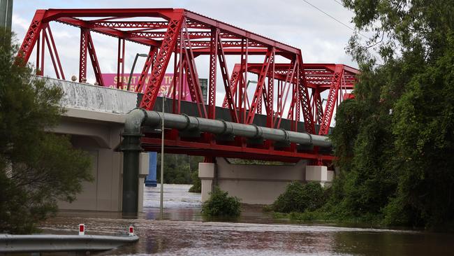 The road under the Red Bridge at Beenleigh was covered in water and blocking traffic. Picture: NIGEL HALLETT