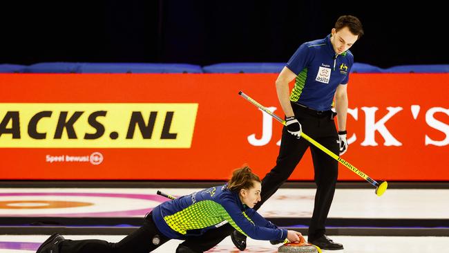 Australian Tahli Gill and Dean Hewitt during the playoff in the mixed team curling qualifying tournament for the Winter Olympics.