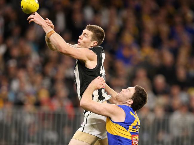 Mason Cox spills mark in front of West Coast’s Jeremy McGovern last week. Picture: Michael Klein