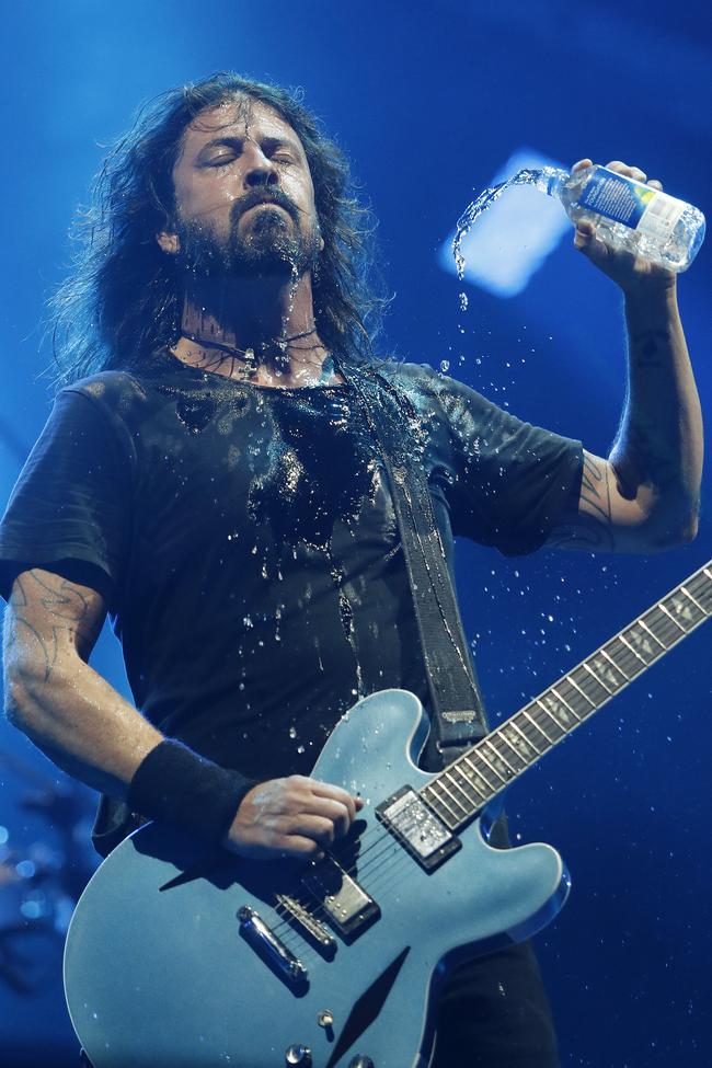 Dave Grohl cools off during Foo Fighters’ show at Brisbane’s Suncorp Stadium last night. Picture: Josh Woning/AAP