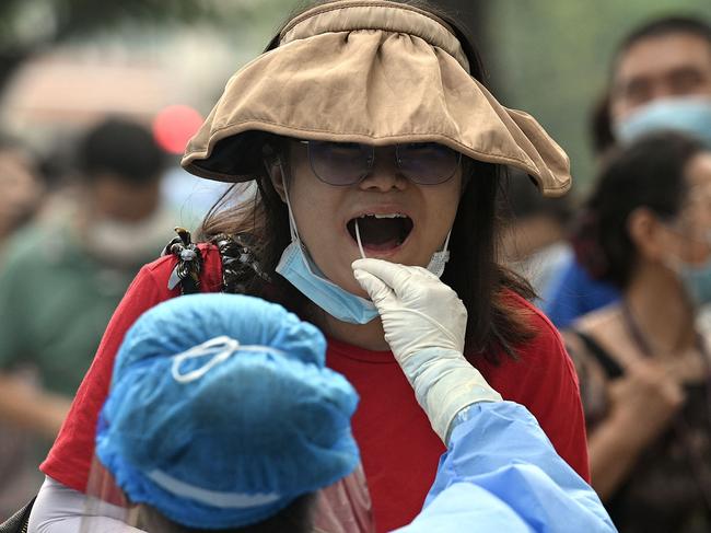 A woman has a sample taken for Covid testing in Beijing. Picture: AFP