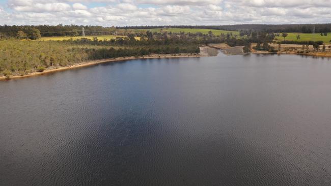 AFTER: There is no sign that the man-made Lake Kepwari, near Collie in southwest Western Australia, used to be the Yancoal-operated Premier Coal mine pit, above