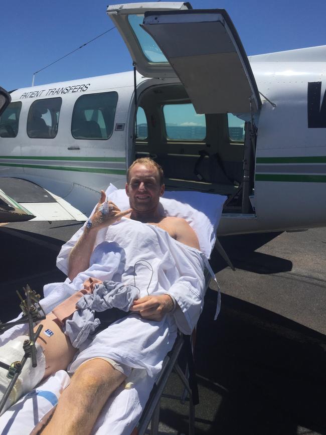 Mark Mathews being loaded into the air ambulance.