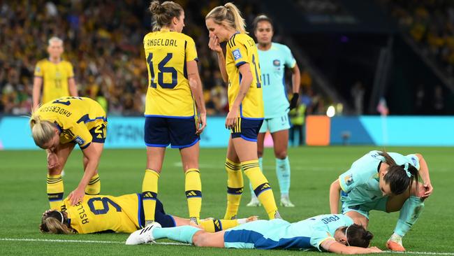 Kosovare Asllani of Sweden and Caitlin Foord of Australia lie on the pitch. Picture: Getty Images