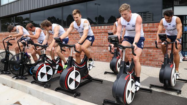 Kangaroos captain Jack Ziebell, Robbie Tarrant, Dom Tyson, Jared Polec and Ben Cunnington on the bikes for conditioning. Picture: Ian Currie