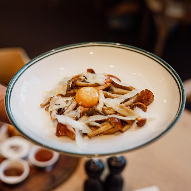 A salad of roasted mushrooms and egg yolk.