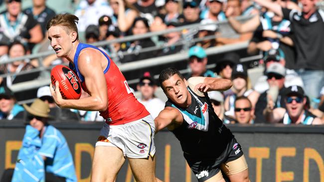 Port Adelaide’s Tom Rockliff tackles former Brisbane teammate Harris Andrews during the round three clash at Adelaide Oval. Picture: James Elsby (AFL Media/Getty Images)