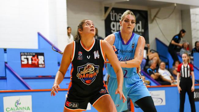 Cayla George (right) is pictured during her last stint with Cairns Dolphins back in 2022. She goes to battle with Darwin Saltie Teyla Evans.
