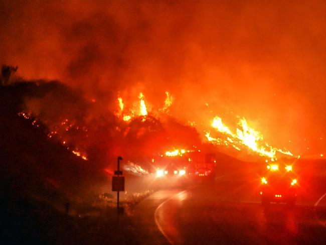 Fireys in California battled their own blazes this year, including this one in Santa Barbara on November 25. Picture: AFP