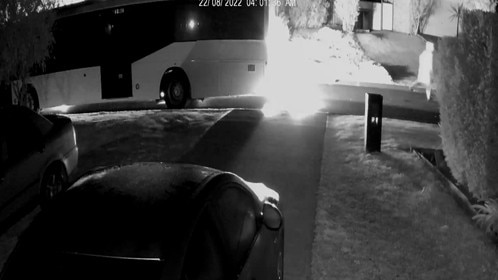 CCTV shows a man running from the scene after the back of a party pus explodes into flames on Streeton Dr, Metford, about 3.40am on August 22, 2022. Picture: NSW Police.